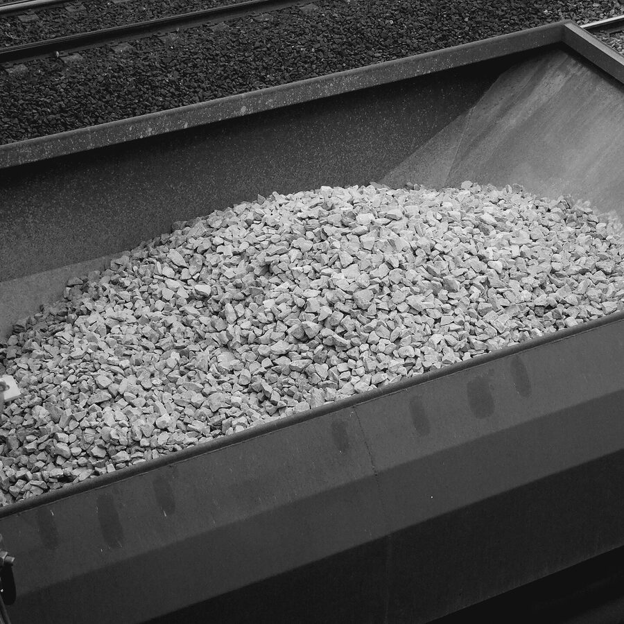 Gondola rail car loaded with crushed stone